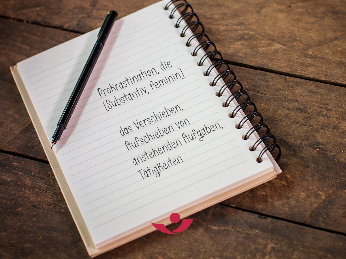 Notizblock mit Wortdefinition für "Prokrastination"